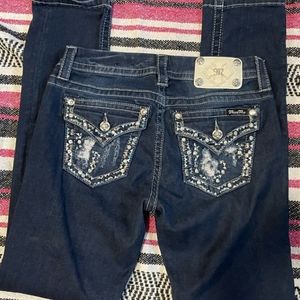 Miss Me's distressed /mid rise easy skinny.